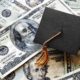 job creators network - Miniature graduation cap on hundred dollar bills | Will Biden Cancel Student Debt? Deluded Schumer Thinks Yes