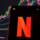 Netflix stock index is seen on a smartphone screen | Netflix Stocks Lose $50 Billion As Subscribers Quit | featured