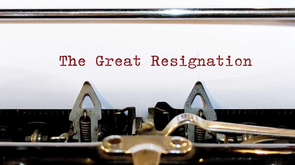 Old classic vintage typewriter with typed text THE GREAT RESIGNATION | 40% of Great Resignation Job Switchers Looking For a New Job | featured