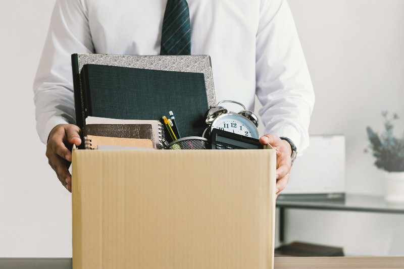 Resignation. businessmen holding boxes for personal belongings and resignation letters | Job Switchers Hold the Power in the Labor Market Now