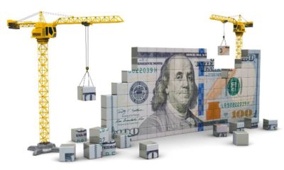 two cranes building 100 dollars | Construction Spending