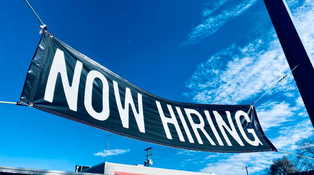 Now Hiring Banner Sign Outside Business Employee Interviews Advertisement | March JOLTS Report: 2 Openings for Every Jobless Workers | featured