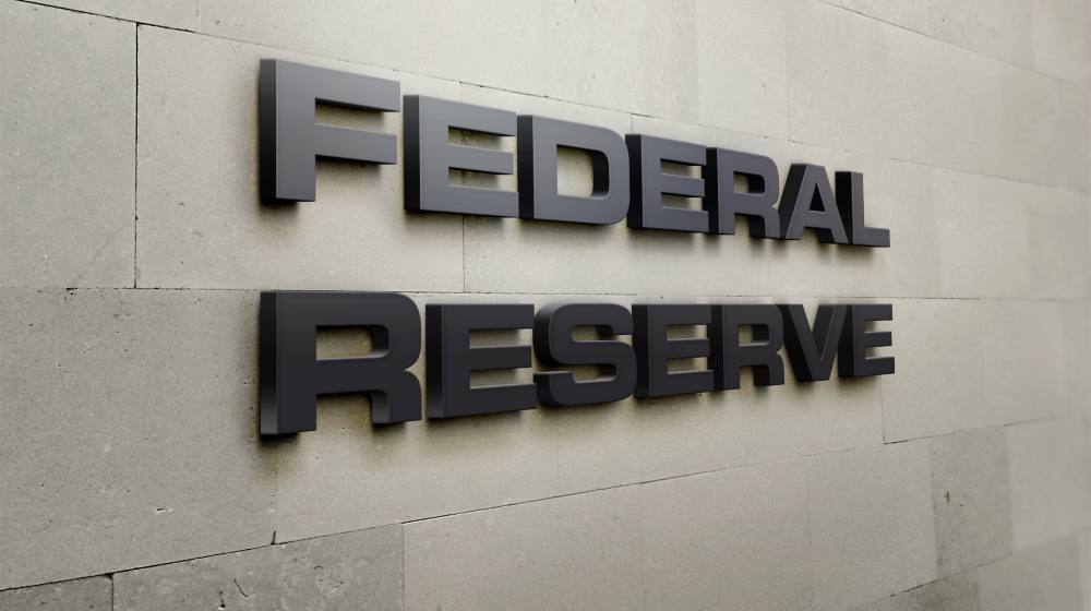 A building signage that says 'Federal Reserve' | Federal Reserve Now Says Inflation Longer Than Expected | featured