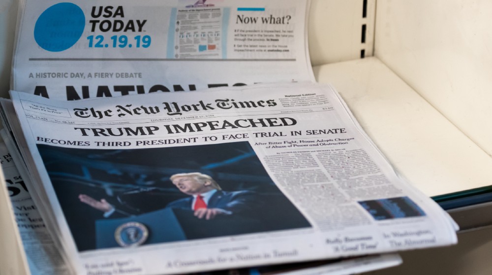 A couple of Newspapers with top news about President Donald J. Trump Impeachment-Impeachment Is Constitutional-ss-featured
