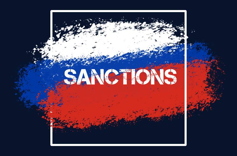 A drawn Russian flag with the text of the sanctions on a black background | Russian Censors Limiting Information on Twitter