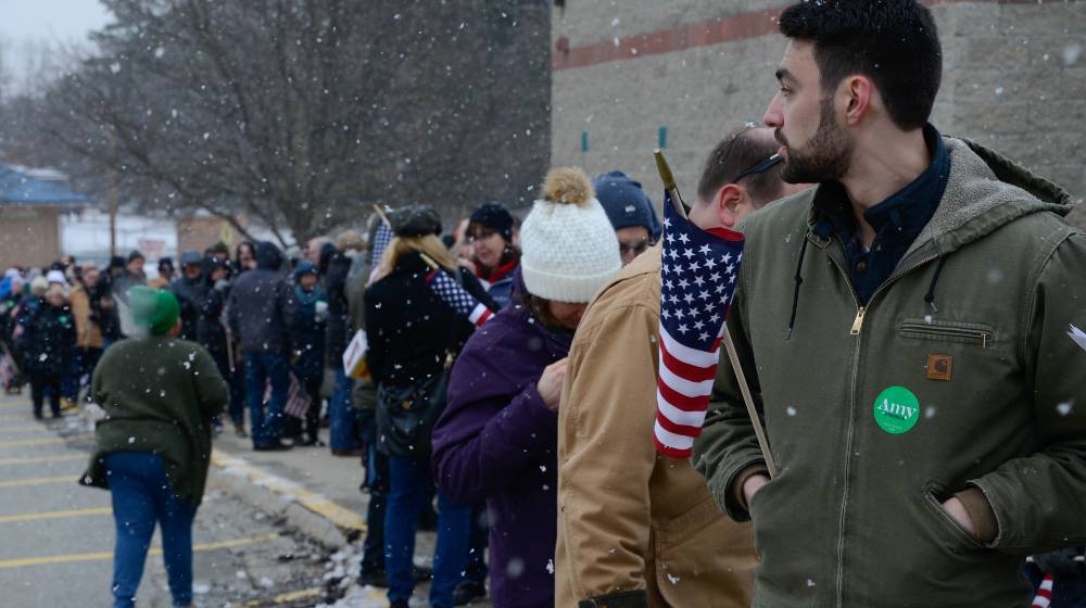 A long line of voters waits to get into Sen. Amy Klobuchar's town hall | Voters have a problem with authority | featured