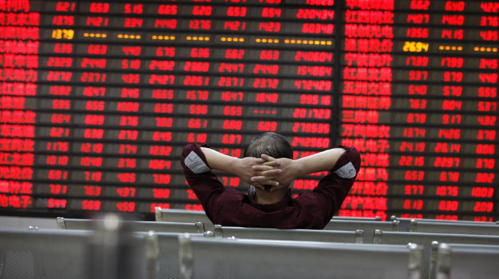 An investor watchs electric board in a stock market in Huaibei | What Is a "Blood in the Streets" Moment? | Featured