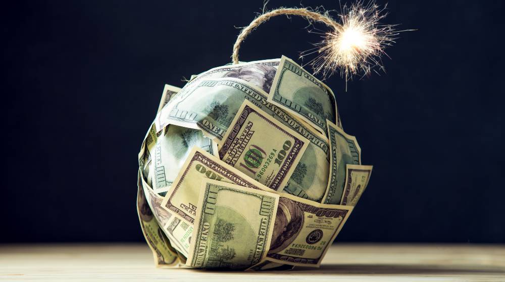 Big bomb of money hundred dollar bills with a burning wick | October CPI Climbs to 6.2%, Highest Rate in the Last 30 Years | featured