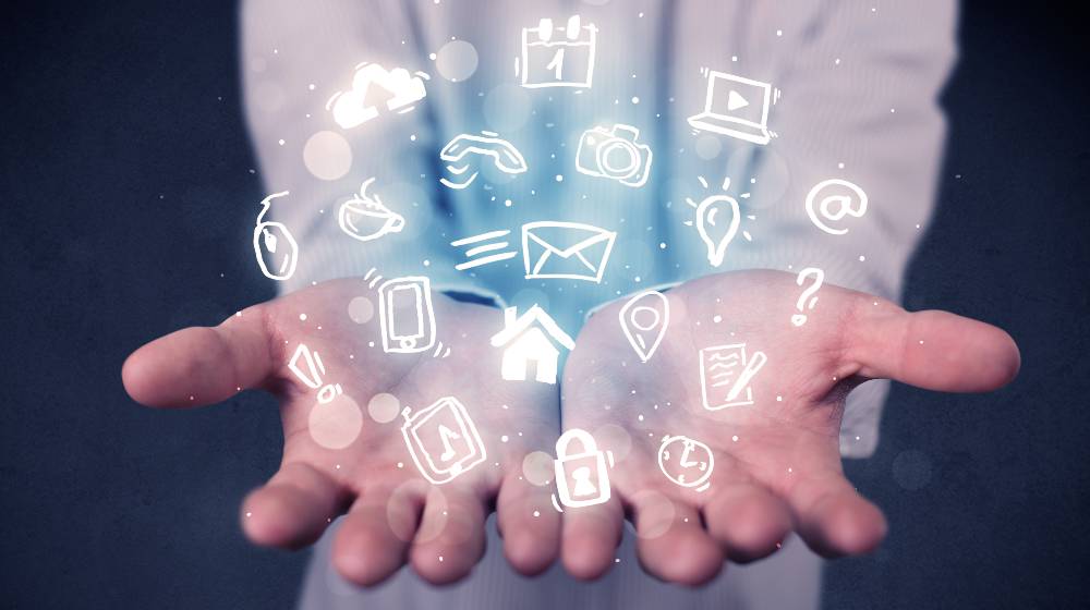 Blue multimedia icons in the hands of a businessman | CFPB Looking Into Data Harvesting Practices of Big Tech Firms | featured