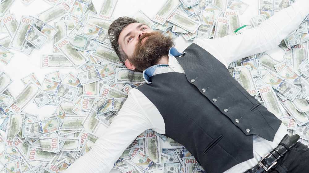 Business man, millionaire, billionaire, bearded man with many banknote | Top 10% Of Wealthiest Americans Own 89% Of All US Stocks | featured