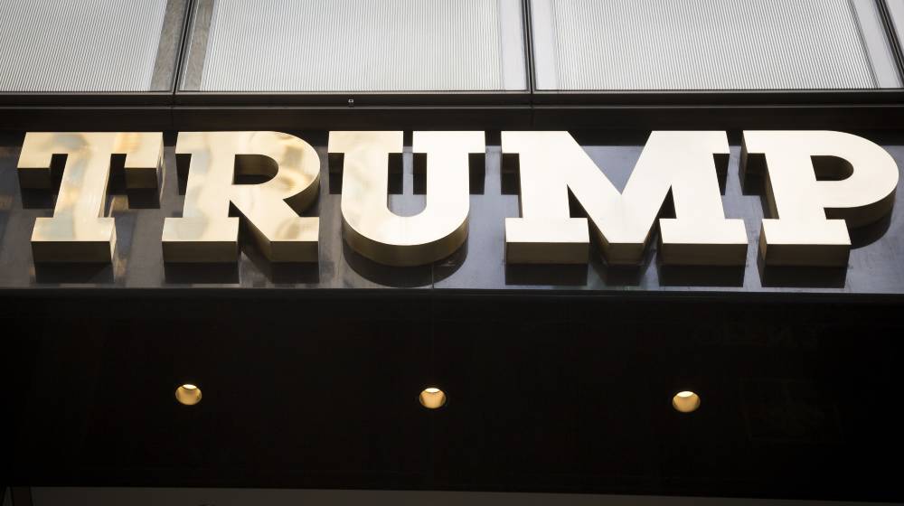 Close up of the gold facade of Trump Tower | Manhattan DA Unwilling To Indict Trump On NY Tax Cases | featured