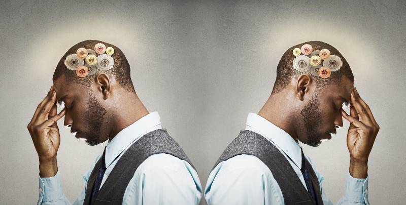Closeup side view profile headshot two thoughtful men | Emotionally Intelligent in Business