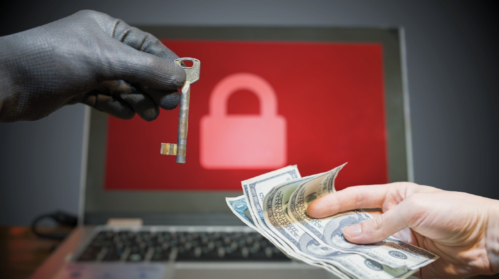 Computer security and extortion concept. Ransomware virus has encrypted data in laptop | Colonial Pipeline Hackers Received $5 Million Ransom | Featured