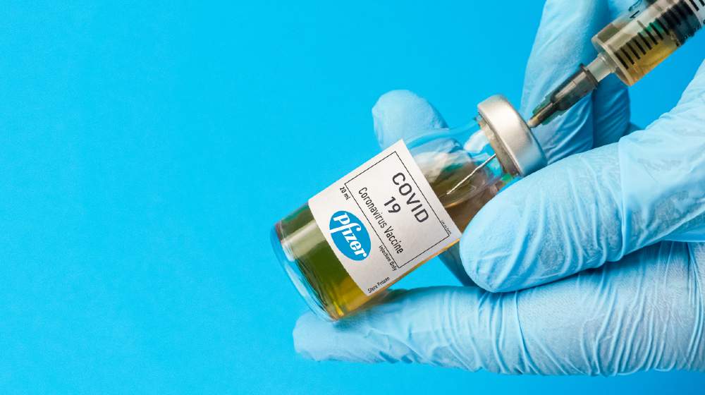 Coronavirus vaccine concept and background. New vaccine pfizer and biontech isolated on blue background | FDA OKs Pfizer-BioNTech COVID-19 Vaccine for Teens | Featured