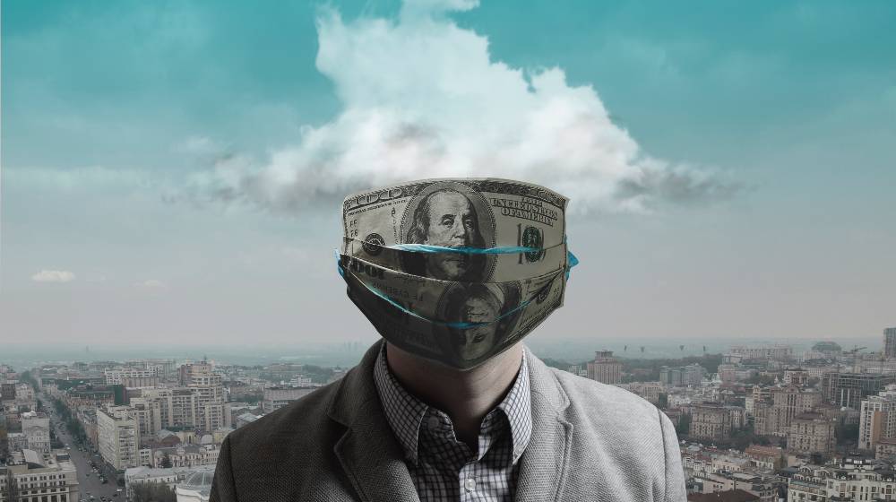 Creative concept of the 2020 economic crisis, money inflation during the coronavirus | Economists Can’t Agree On The Major Cause of Inflation | featured