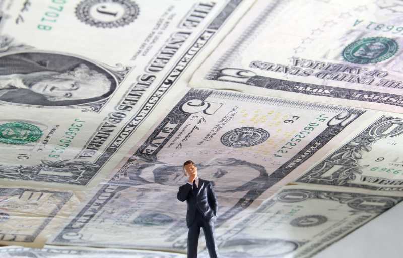 Debt Ceiling. Political figure standing under a ceiling made of US money-US House