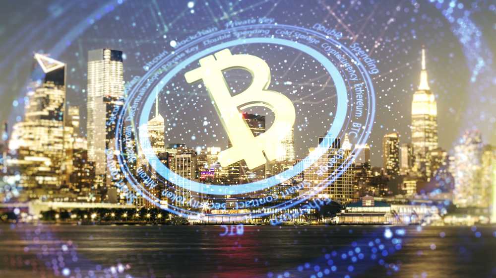 Double exposure of creative Bitcoin symbol hologram | Alleged Inventor Of Bitcoin Wins Lawsuit Vs. Former Partner | featured