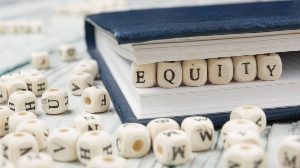 EQUITY word written on wood block. Wooden Abc | Advantages of Equity Investments | featured