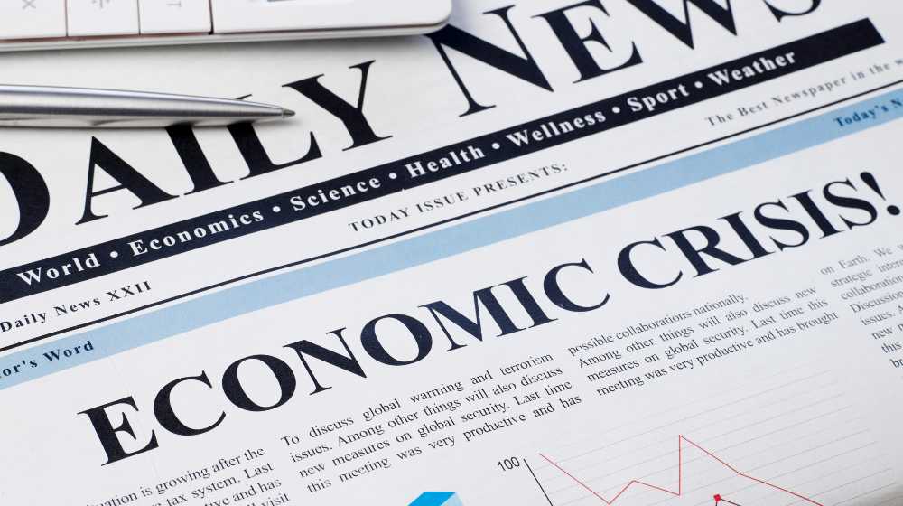 Economic crisis headline on newspaper | Survival Economic Collapse: 16 Practical Ways to Survive An Economic Crisis | featured