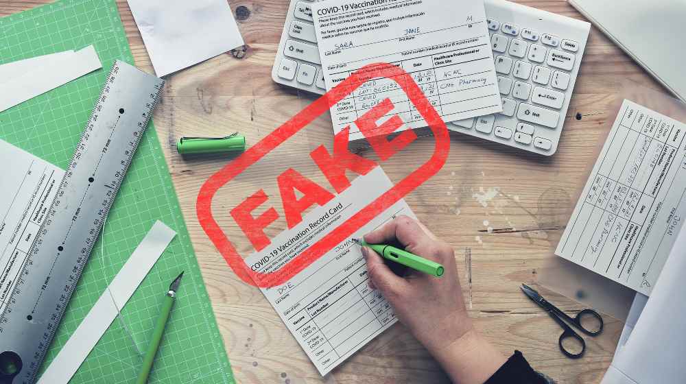 Fake covid vaccination record card. Forgery of health certificate confirming vaccinations against covid-19 | 2 NY Nurses Made $1.5 Million Selling Fake Vaccine Cards | featured