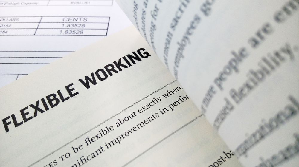 Flexible working word on the book with balance sheet as background | Employers, it's time to embrace flexibility | featured
