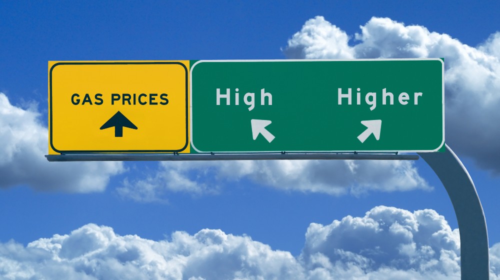 Freeway sign on blue cloudy skies reading, Gas prices - high and higher | Energy Crisis Worsens As Gas Prices Are Now $3.27 A Gallon | featured