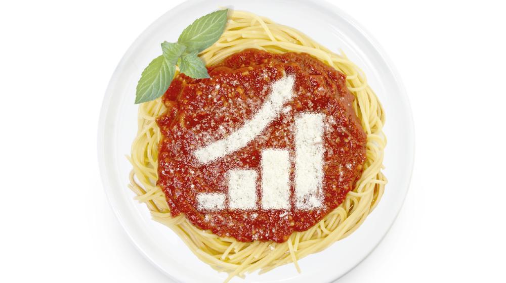 Freshly cooked dish of tasty pasta with tomato sauce and parmesan cheese in the shape of a growing bar chart | Restaurant Prices Rise Amid Inflation, Labor Shortage | Featured