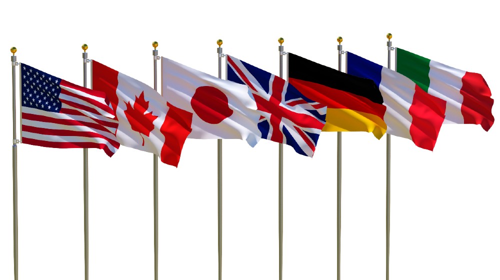 G7 flags Isolated Silk waving flags of countries of members Group of Seven Canada Germany Italy France Japan United States United Kingdom | G7 Nations Agree To 15% Minimum Corporate Tax | featured