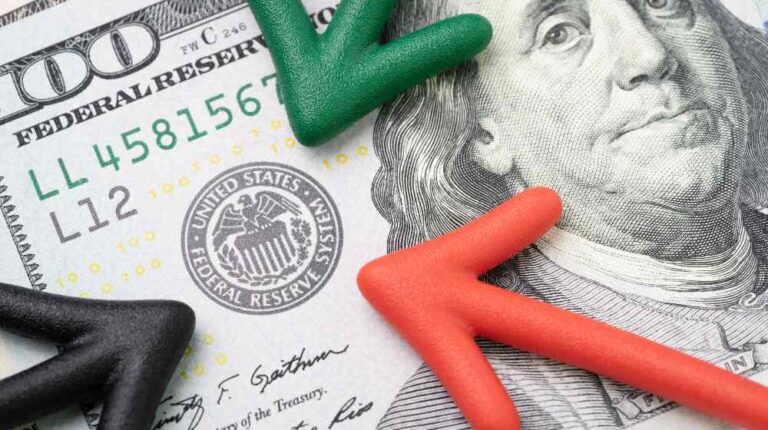 Green, red and black arrow pointing to US Federal Reserve | The Fed Will Start Tapering Its Bond Purchases This Month | featured