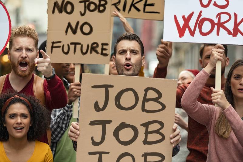 Group of demonstrators with banners protest for job and equal salaries | initial Jobless Claims