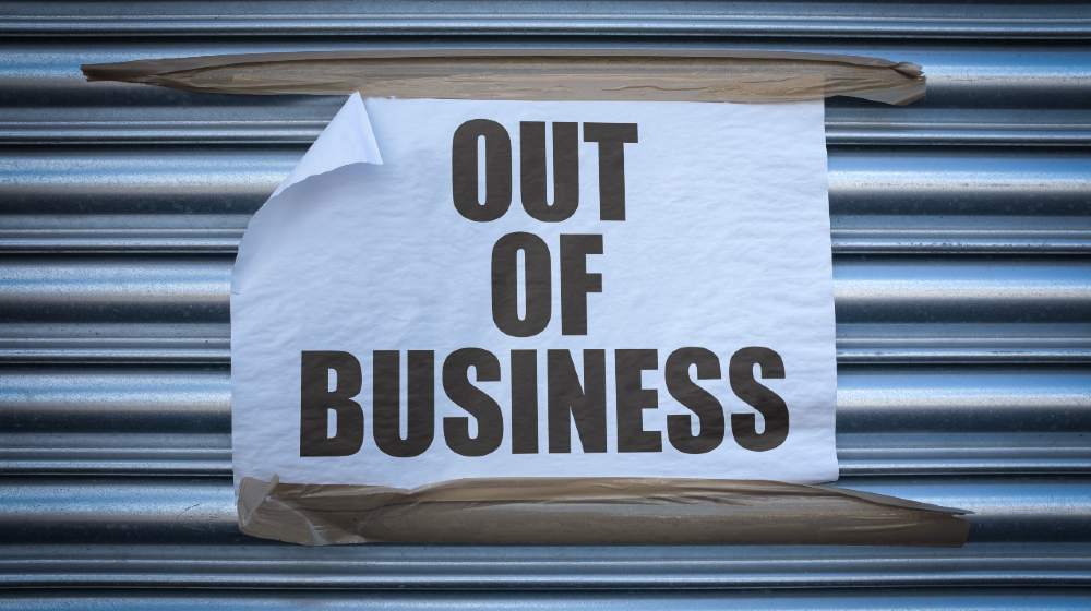 Grungy Out Of Business Sign On Some Old Store Shutters, A Consequence Of The 2020 COVID Pandemic | What are the reasons for business failures? | featured