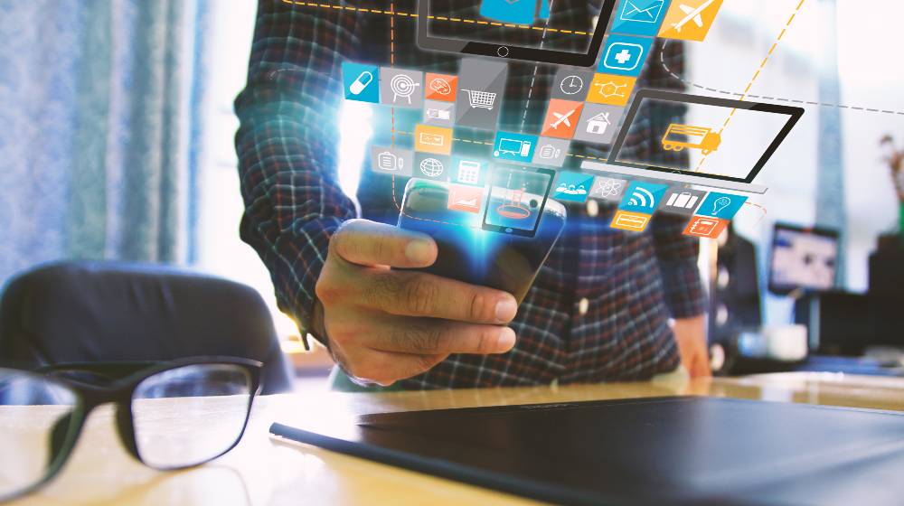 Hand touch screen smart phone.Digital technology concept | 6 Best Growth Stocks for 2022 | featured