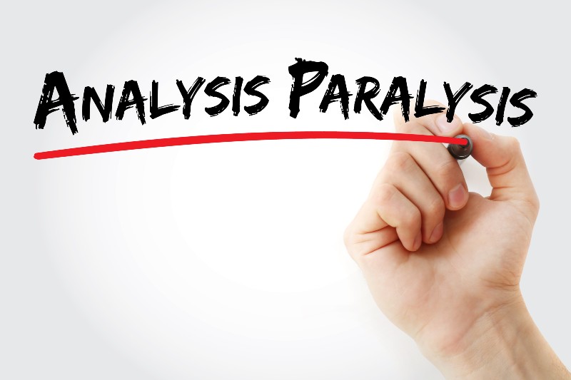 Hand writing analysis paralysis with marker, concept background | analysis paralysis