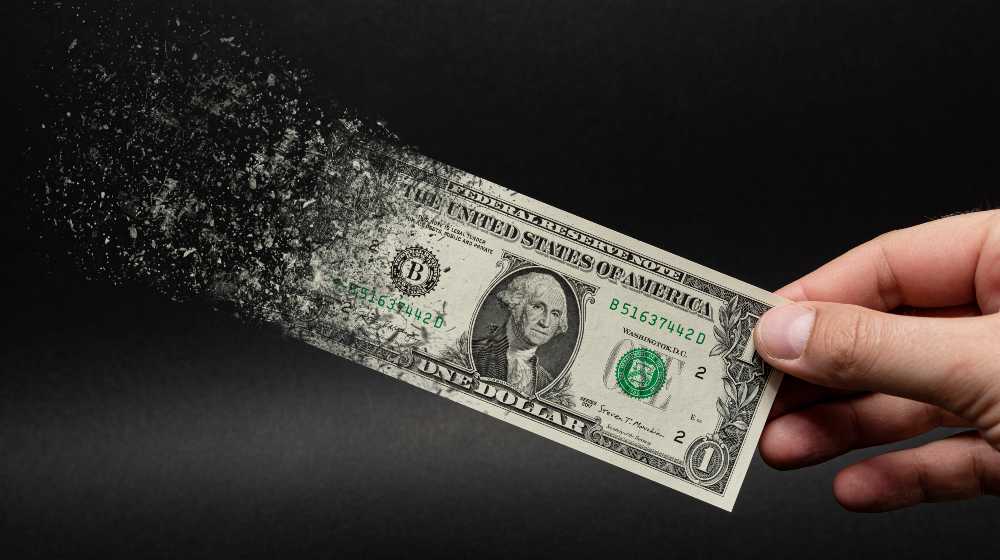 Inflation, dollar hyperinflation with black background | Paul Tudor Jones Says Inflation Is Here To Stay | featured