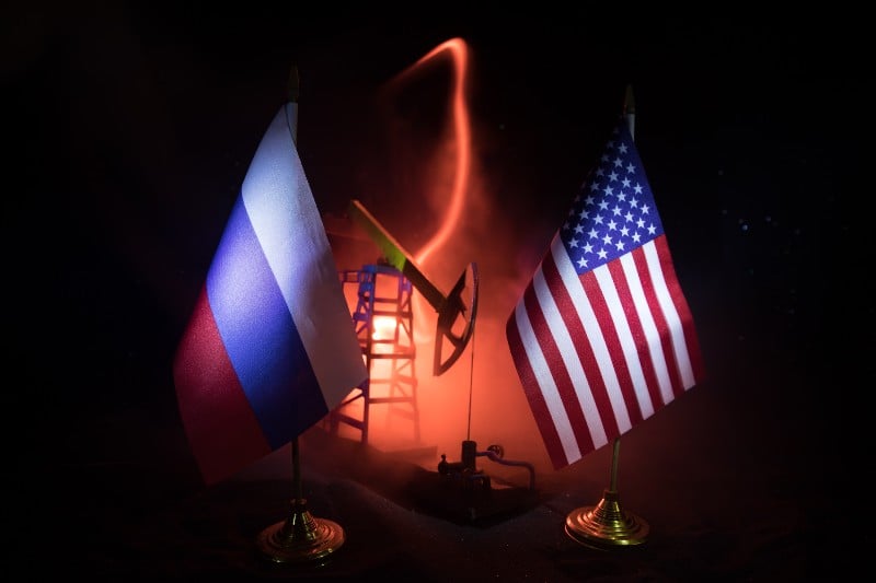National flags with Oil pump and oil refining factory at night | Oil Prices Climb As Global Tensions Continue