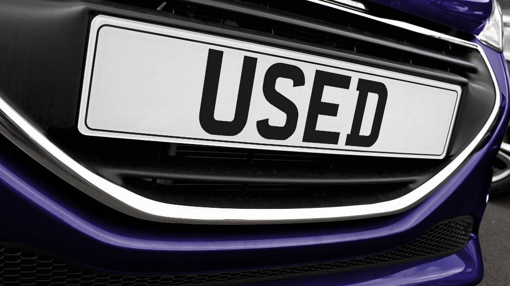 Number plate of a used car for retail sale on a motor dealers | Used Car Prices Are Rising Faster Than Bitcoin | featured