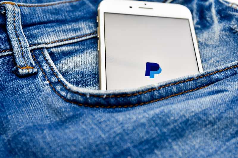 Paypal application icon on Apple smartphone | The Incredible Story of the PayPal Mafia W/ Jimmy Soni