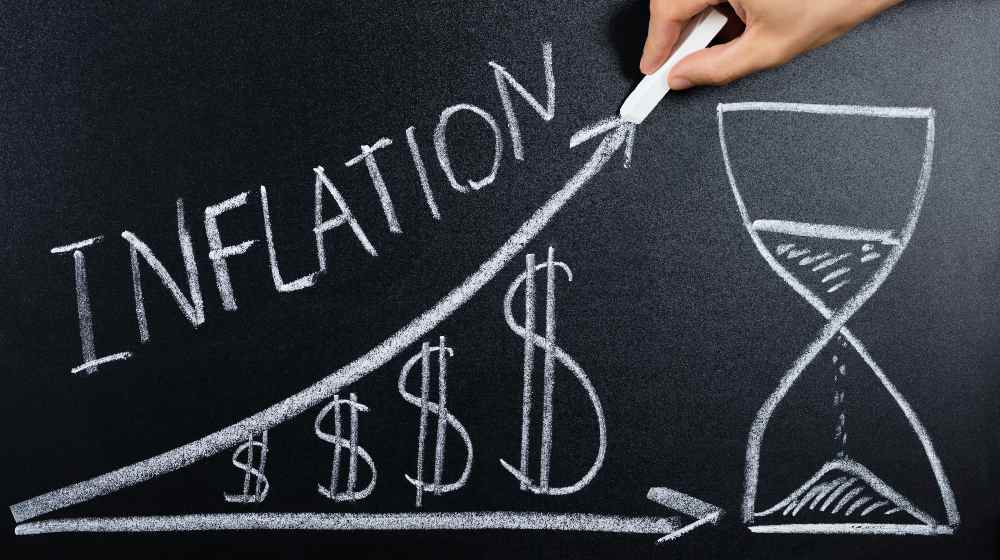 Person Hand Showing Inflation Concept | January Inflation Rate Hits 7.5%, Sets New 40-Year Record High | featured