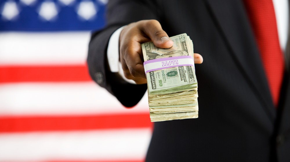 Politician Offering Stack Of US Money To Camera | Toyota Defends Its Political Donations To Republicans | featured