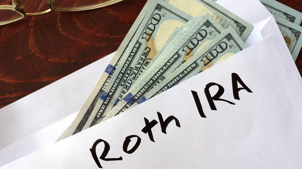 Roth IRA written on an envelope with dollars | Understanding the Use of Roth IRAs | featured