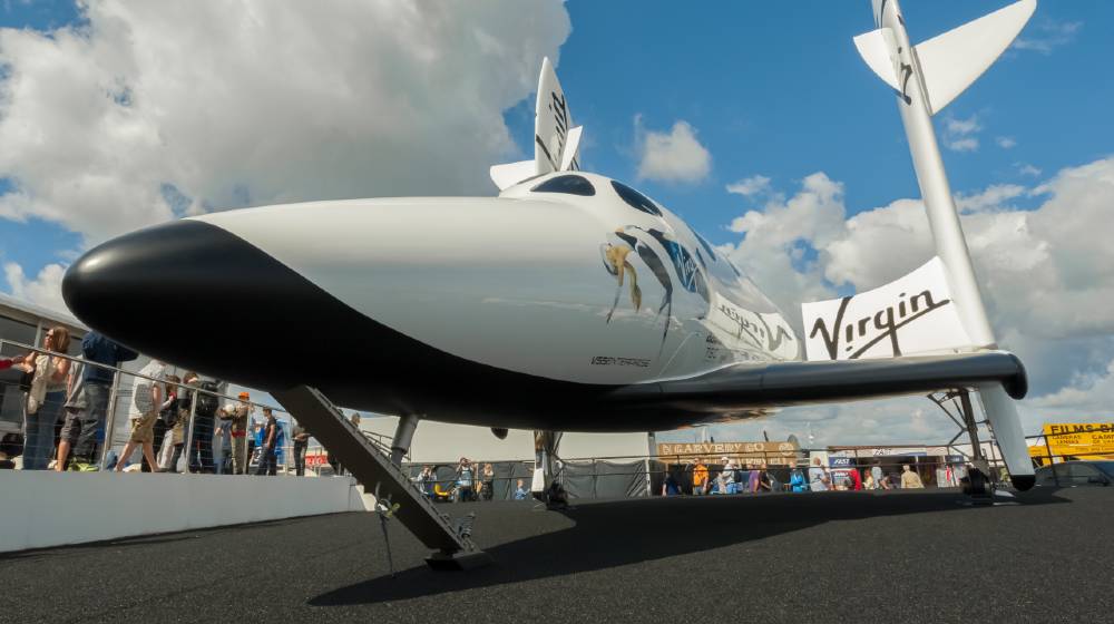 The futuristic Virgin Galactic reuseable, sub-orbital spacecraft on static display | Space Race Heats Up As Virgin Galactic To Launch July 11 | featured