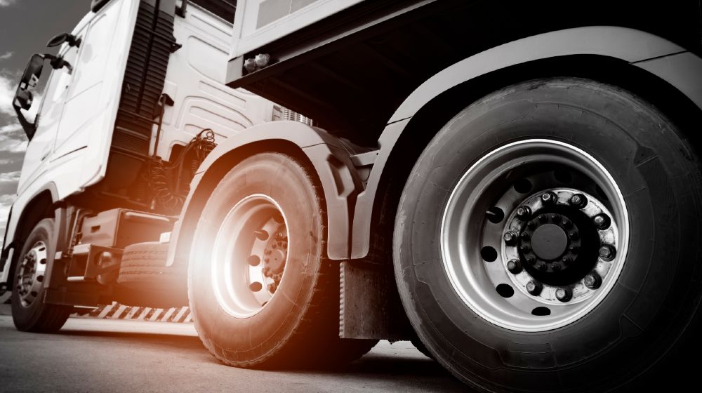 Truck transportation, close up wheel of semi truck-Dent Tires-ss-featured