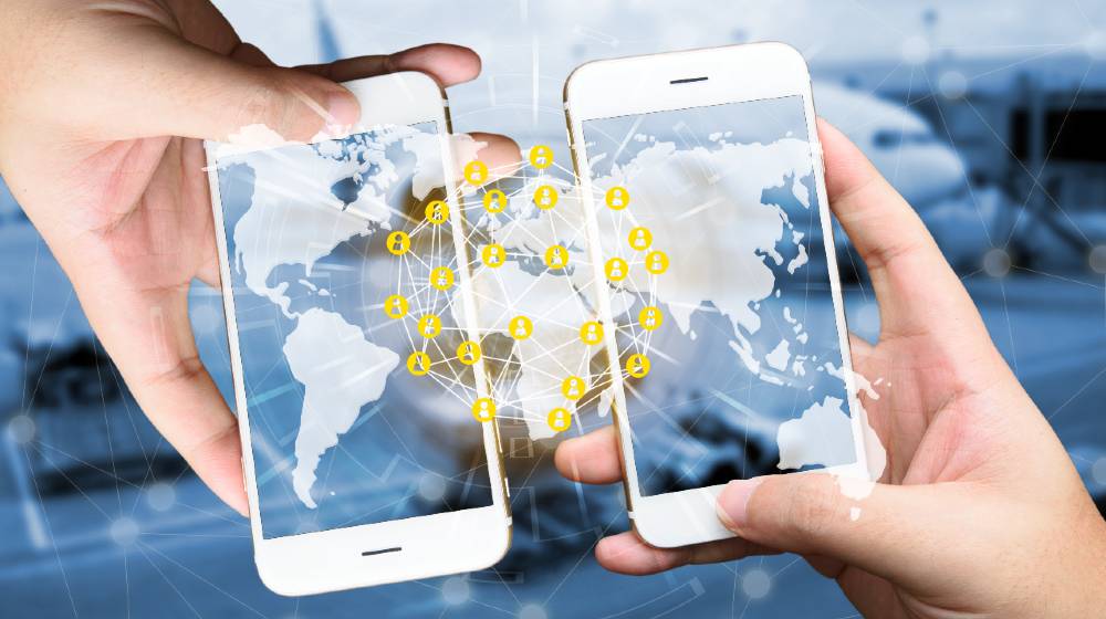 Two Businessman hands holding smartphones | Peer To Peer Cryptocurrency | featured