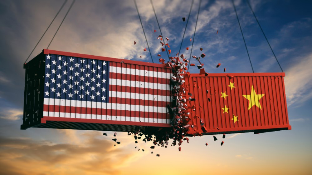 USA and China trade war. US of America and chinese flags crashed containers on sky-us china relations-ss-featured