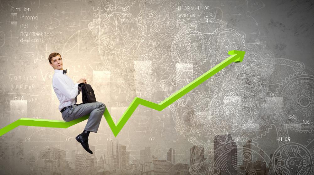 Young businessman riding graph arrow going up-Jeremy Siegel-ss-featured