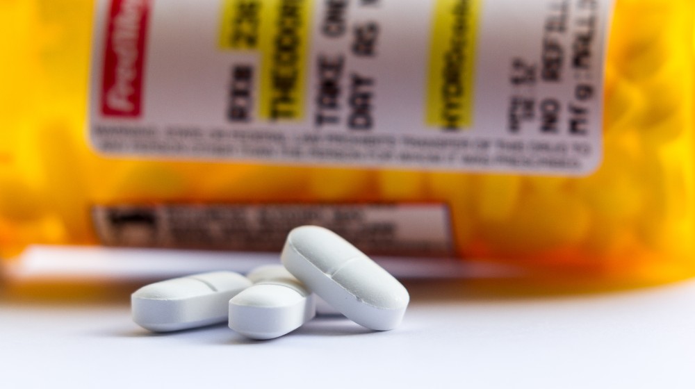 close up of a recognizable opioid pain killer | Jury Finds CVS, Walgreens, and Walmart Liable for Opioid Crisis | featured