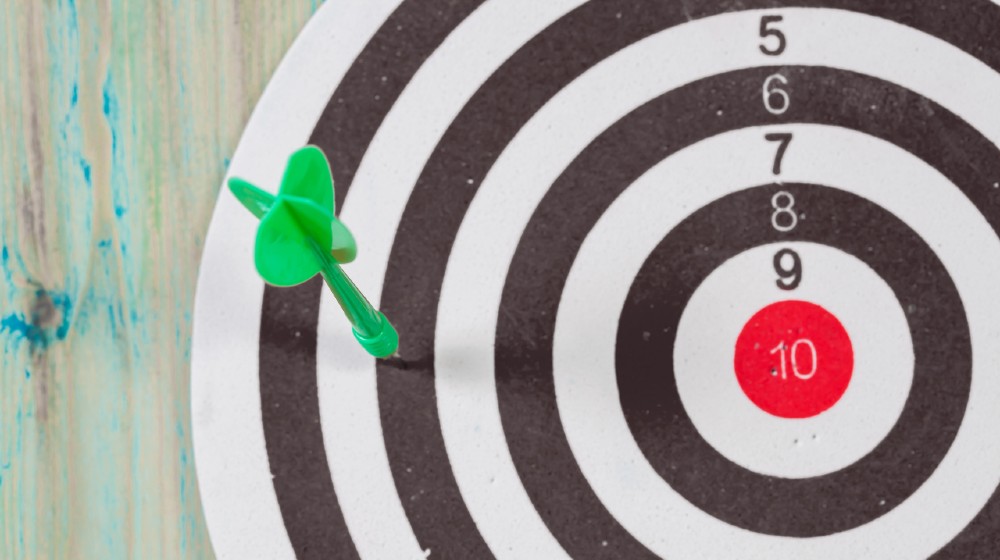 ATTACHMENT DETAILS dart-arrow-missed-in-the-target-center-of-dartboard | Biden Declares Success Even As US Misses Vaccine Goal | featured