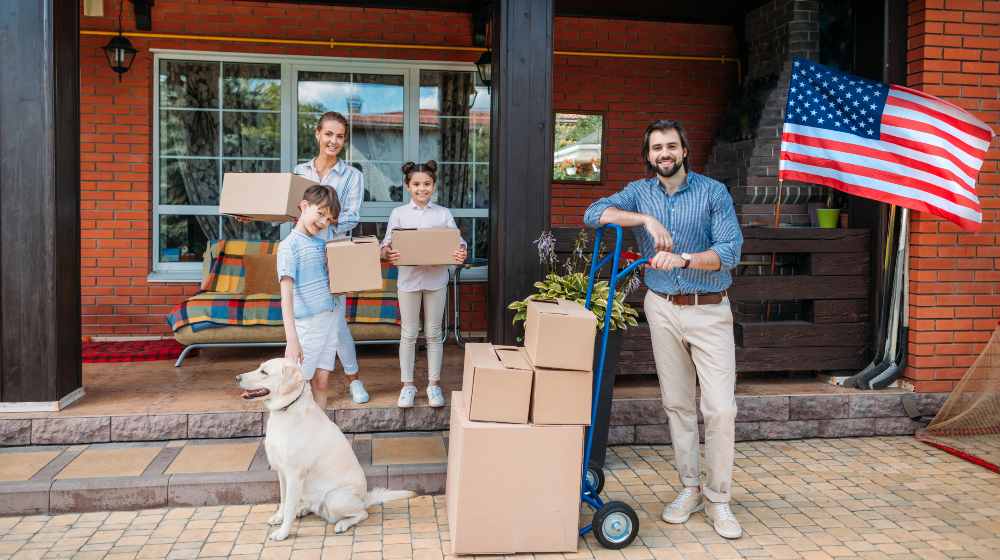 family with cardboard boxes and labrador dog | 600,000 People Left New York and California For Lower Tax States Such As Florida and Texas | featured
