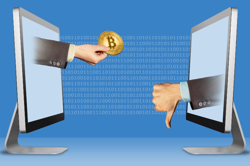 hand with bitcoin and thumbs down, dislike-Bitcoin