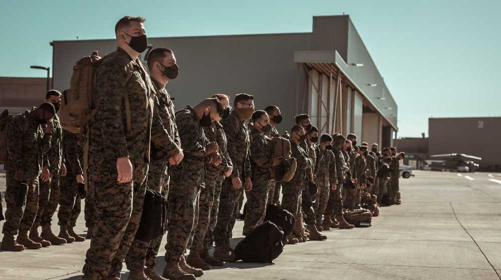 men in black and brown camouflage uniform standing on brown floor | Marines Corps Set To Have Military’s Worst Vaccination Record | featured